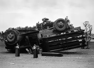 Flipped Navy truck June 22, 1944