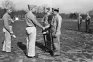 Maj Rockwell presenting Bronze Star to PFC M F Flaherty snd Purple Heart to PFC A J Lepere April